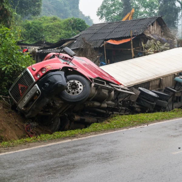 An image showing a commercial truck and an 18-wheeler involved in a crash.